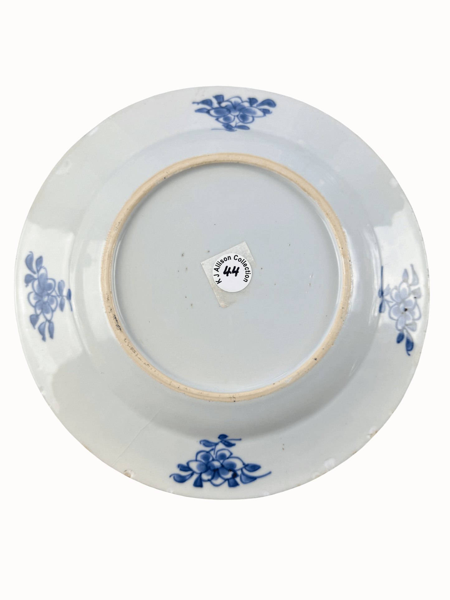 Antique Qianlong period blue and white plate base with floral designs, ex K J Allison Collection.