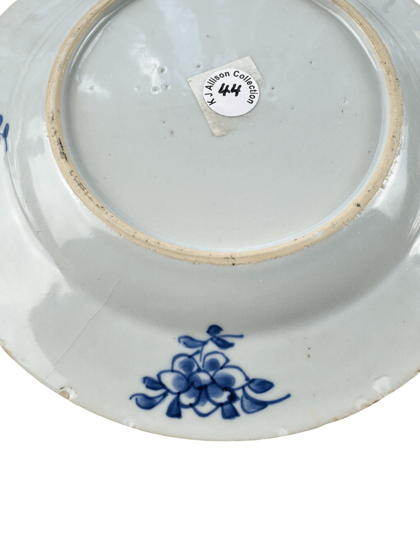 Underside view of antique Chinese Qianlong blue and white plate from K.J. Allison Collection with floral design.