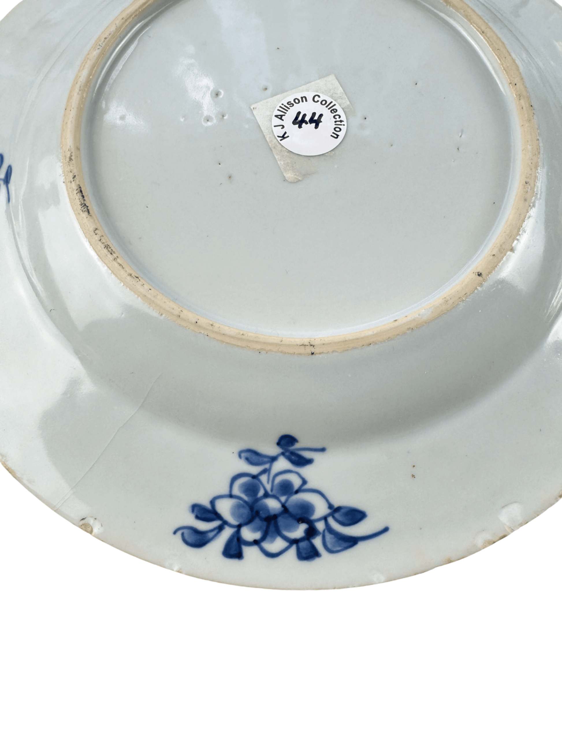 Underside view of antique Chinese Qianlong blue and white plate from K.J. Allison Collection with floral design.