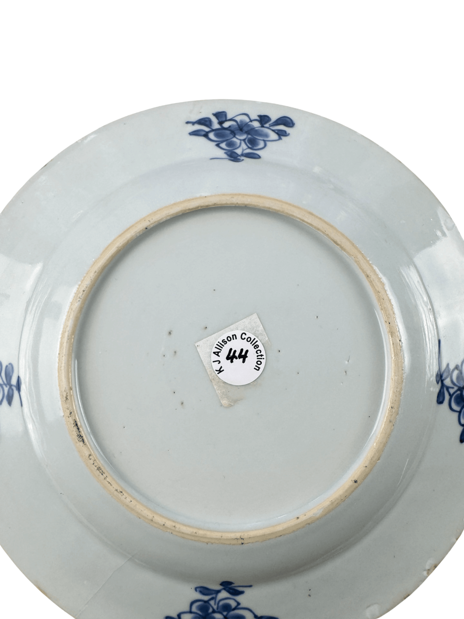 Bottom view of the antique Chinese blue and white plate from the K J Allison Collection, featuring floral designs.