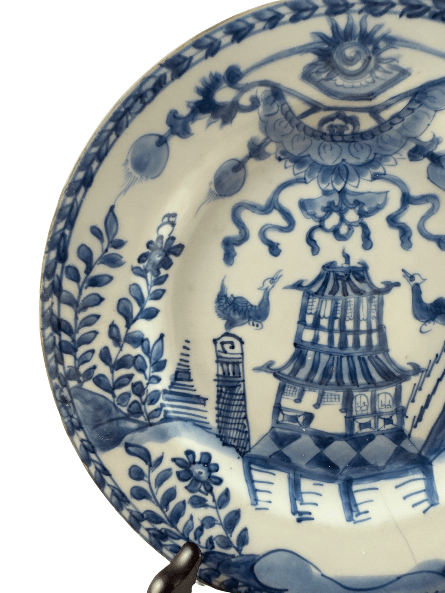 Antique Chinese Qianlong period blue and white plate featuring a building and birds in a lush landscape.