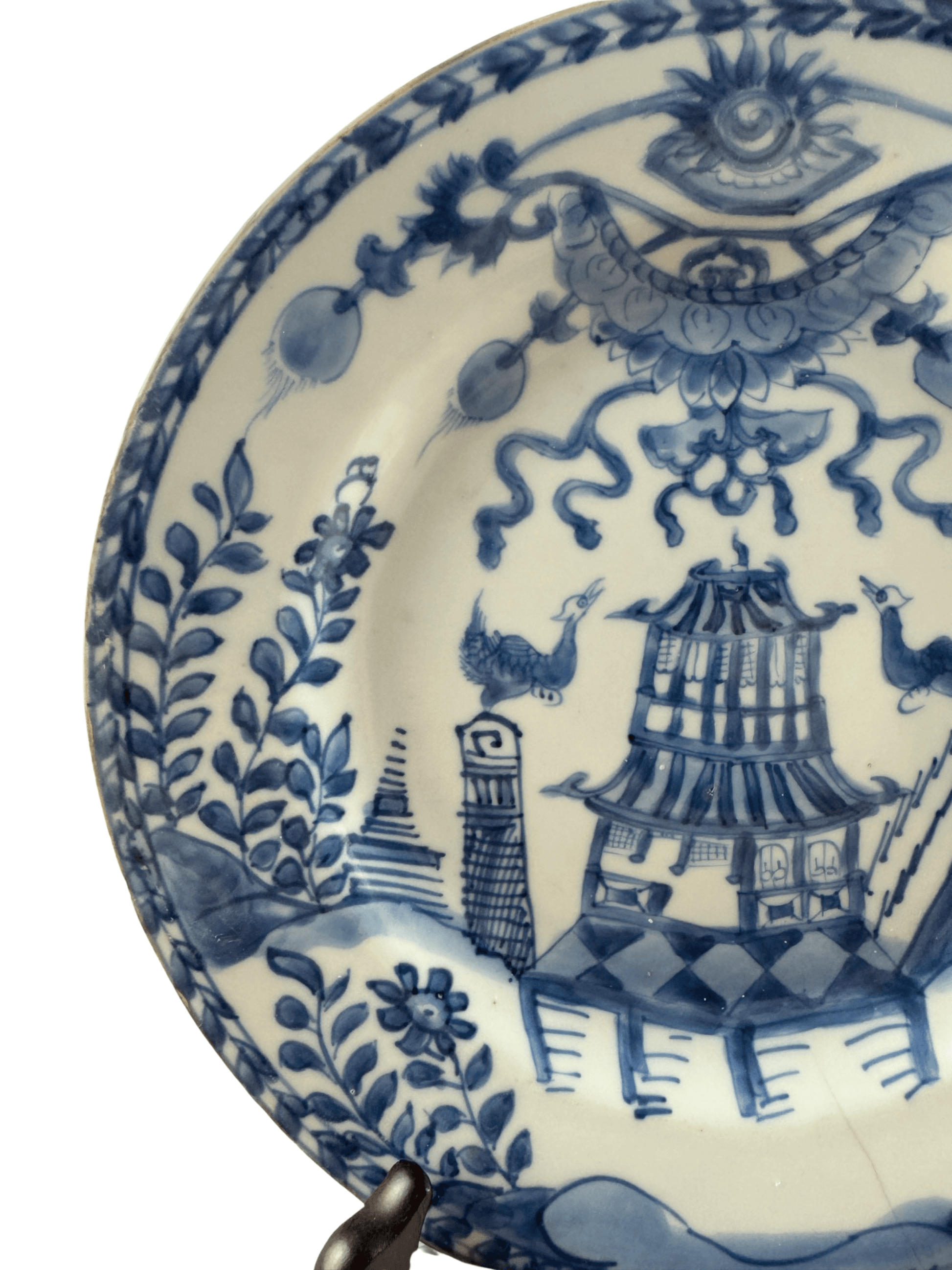 Antique Chinese Qianlong period blue and white plate featuring a building and birds in a lush landscape.
